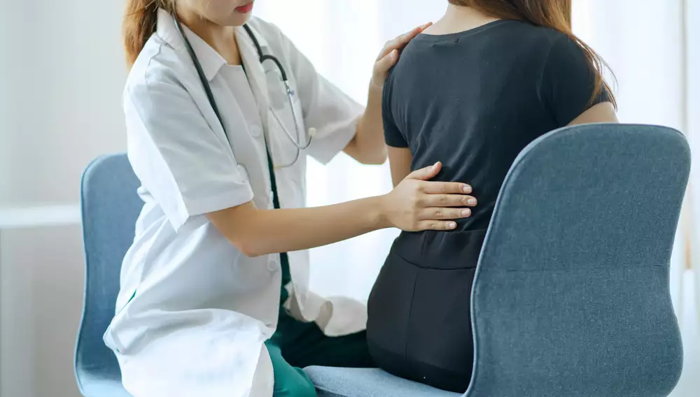 This is an image of a chiropractor consulting a patient.